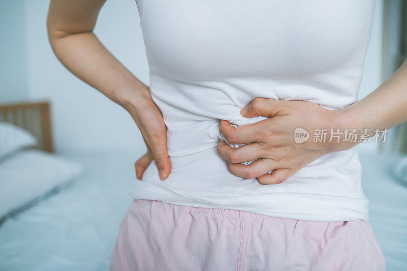 Woman Touching Abdomen In Pain